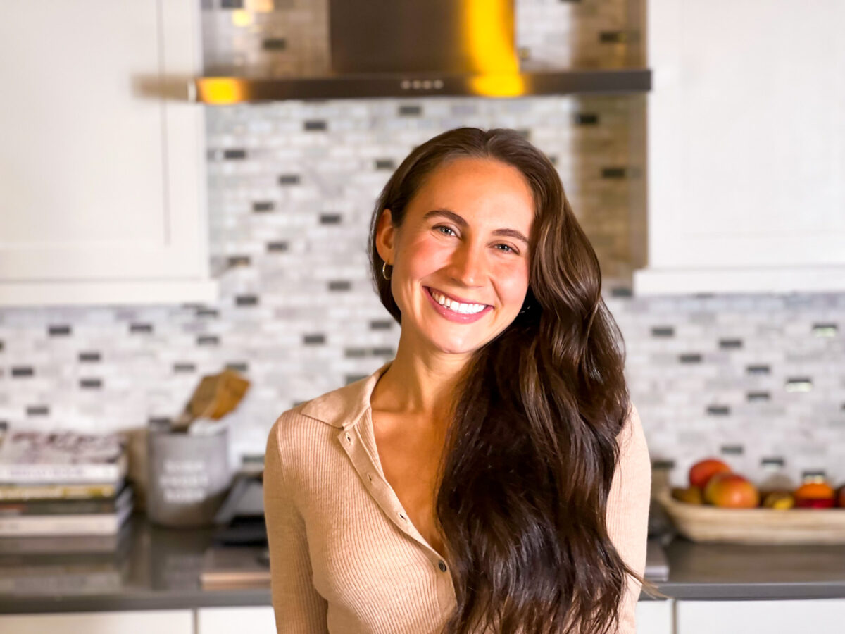 About me photo standing in the kitchen